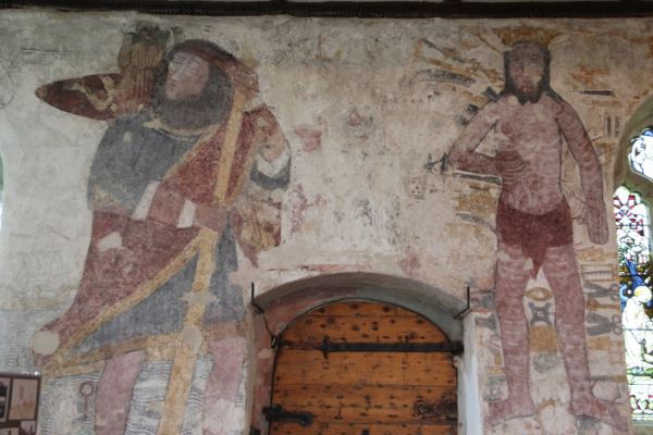 Newly-restored paintings over the north door